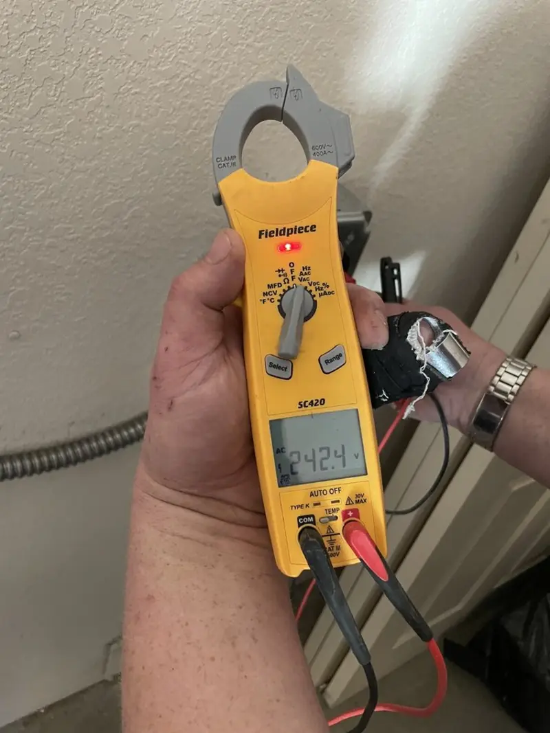 Voltage testing with clamp meter during Recessed Lighting Installation in Sullivan